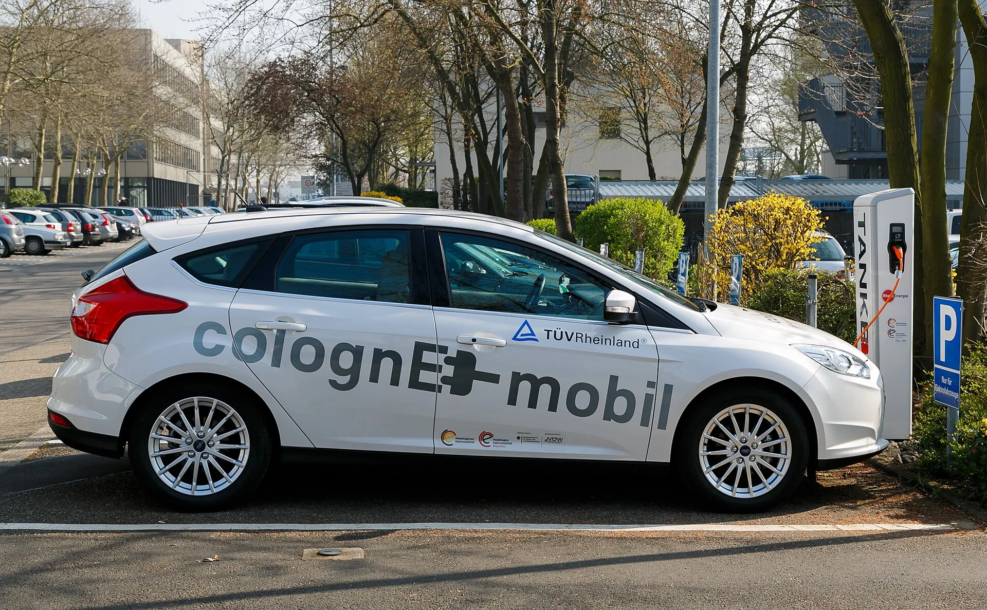 electric car charging at public station