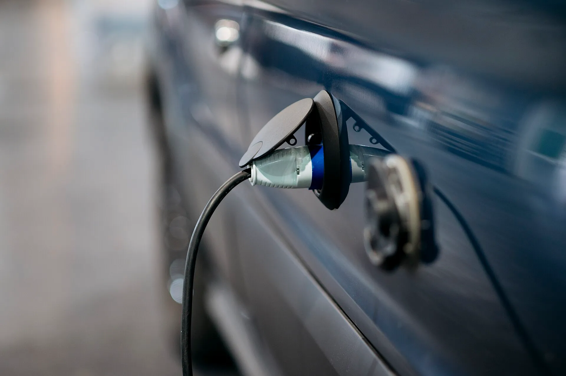 electric car charging cable plugged in